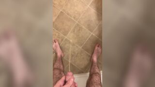 Hairy veiny uncut dick pissing with an erection on the bathroom floor - 3 image