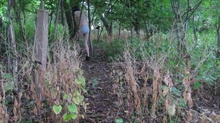wearing very baggy underclothes outdoors in the woods to stripped