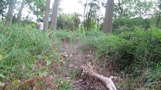wearing very baggy underclothes outdoors in the woods to stripped