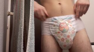 Hot boy wetts his diaper and changes it