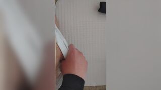 having fun and massaging his penis