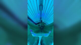 Smooth muscle hunk stripping and stroking in tanning room - 1 image