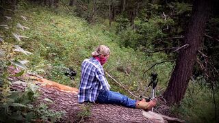 Outdoor twink wanks himself on a log wearing big boy boots! - 1 image