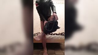 The puppy shows his body in leather