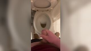 a guy pisses and then masturbates in the bathroom, cumming with his nice cock all over the place - 10 image