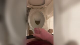 a guy pisses and then masturbates in the bathroom, cumming with his nice cock all over the place - 11 image