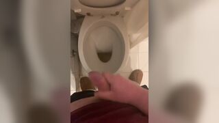 a guy pisses and then masturbates in the bathroom, cumming with his nice cock all over the place - 13 image