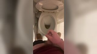 a guy pisses and then masturbates in the bathroom, cumming with his nice cock all over the place - 15 image