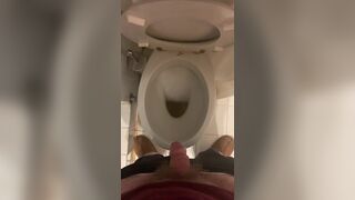 a guy pisses and then masturbates in the bathroom, cumming with his nice cock all over the place - 2 image