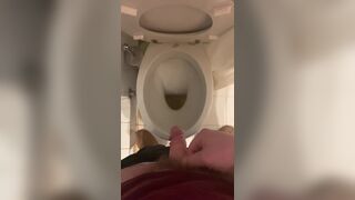 a guy pisses and then masturbates in the bathroom, cumming with his nice cock all over the place - 3 image
