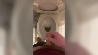 a guy pisses and then masturbates in the bathroom, cumming with his nice cock all over the place - 4 image
