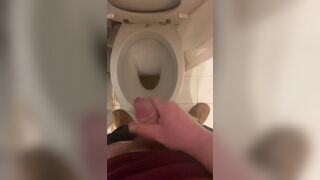 a guy pisses and then masturbates in the bathroom, cumming with his nice cock all over the place - 5 image