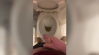 a guy pisses and then masturbates in the bathroom, cumming with his nice cock all over the place - 6 image
