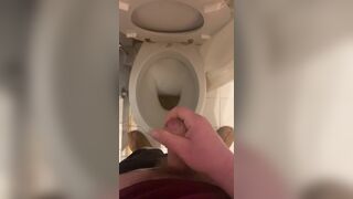 a guy pisses and then masturbates in the bathroom, cumming with his nice cock all over the place - 7 image