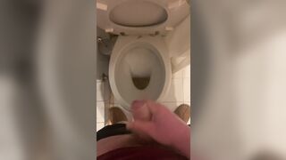 a guy pisses and then masturbates in the bathroom, cumming with his nice cock all over the place - 8 image