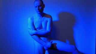Kudoslong nude in a blue light playing with his flaccid cock - 12 image