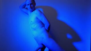 Kudoslong nude in a blue light playing with his flaccid cock - 13 image
