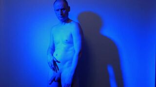 Kudoslong nude in a blue light playing with his flaccid cock - 5 image