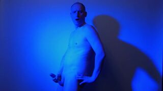 Kudoslong nude in a blue light playing with his flaccid cock - 6 image