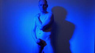 Kudoslong nude in a blue light playing with his flaccid cock