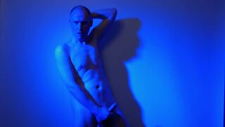 Kudoslong nude in a blue light playing with his flaccid cock - 9 image