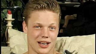 Curly blonde haired boy sucks balls and cock on the couch - 1 image