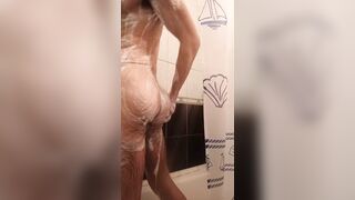 Hairy guy lathering himself in the shower - 1 image