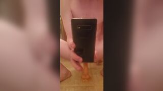 Twink plays with a 10 inch dildo after a shower