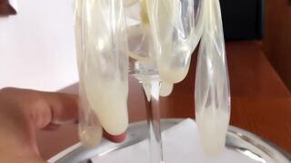 Cumdump drinks many loads of used condoms - cum cocktail - glass of cum