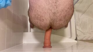 Top down view of dildo riding while standing in shower - 3 image