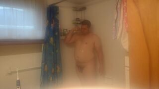 Getting cleaned up in the shower after getting very muddy and dirty - 7 image