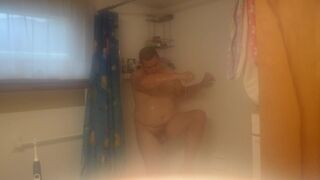 Getting cleaned up in the shower after getting very muddy and dirty - 9 image