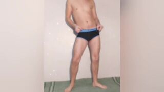 Hot guy tries on black swimming trunks and poses sexy in the - 7 image