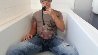 Pissing in a penis pump - 1 image