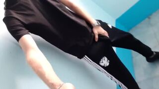 skinny russian lad wanks and cums in trackies - 1 image