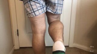 Man does Calf Flexing with X-Mas Socks