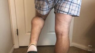 Man does Calf Flexing with X-Mas Socks