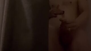 The guy in the shower jerks off his dick and cums abundantly