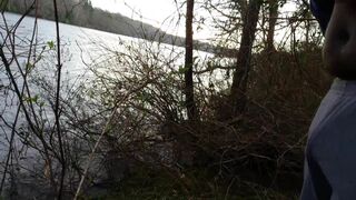 guy walking stops to stroke his black uncut dick on public trail