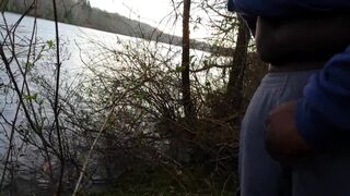 guy walking stops to stroke his black uncut dick on public trail