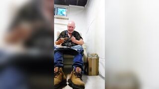 Construction worker relaxing in man cave - 1 image