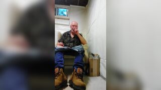 Construction worker relaxing in man cave - 2 image