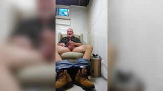 Construction worker relaxing in man cave - 3 image