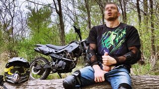 Handsome BIKER while riding a MOTORCYCLE in the forest JERKS OFF and CUMS in public - 1 image
