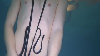 Naked swim and cum with metal cockring and plug