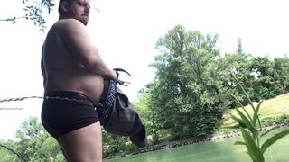 Made to strip, piss, and cum at canal in the middle of the city