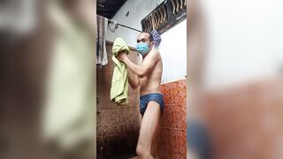 asian boy bathing naked in bathroom with cold water. her body is petite and sexy, her skin is brown and smooth.