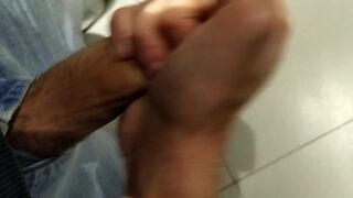 Jerking off in the airport urinals