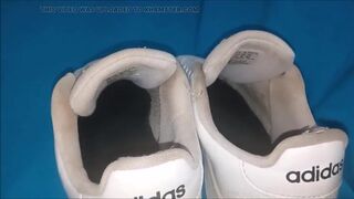 "A pair of white Adidas sneakers worn by a beautiful preppy girl." - 10 image