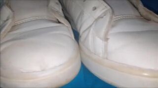 "A pair of white Adidas sneakers worn by a beautiful preppy girl." - 13 image